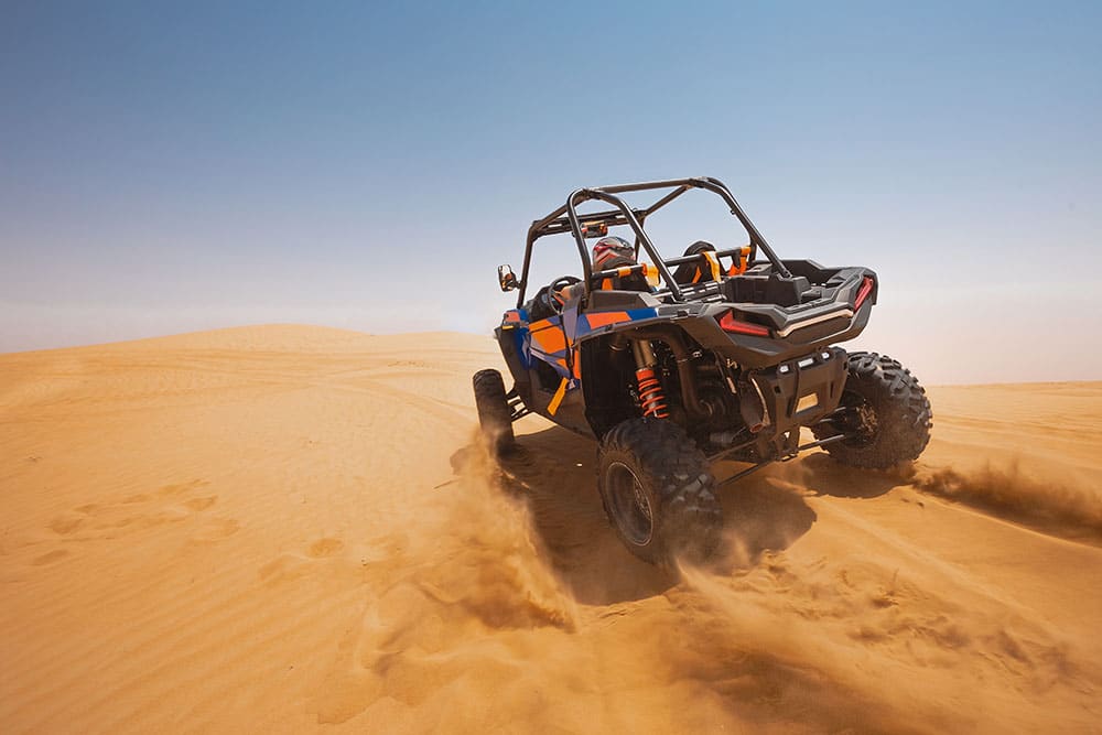 A UTV in sand dunes