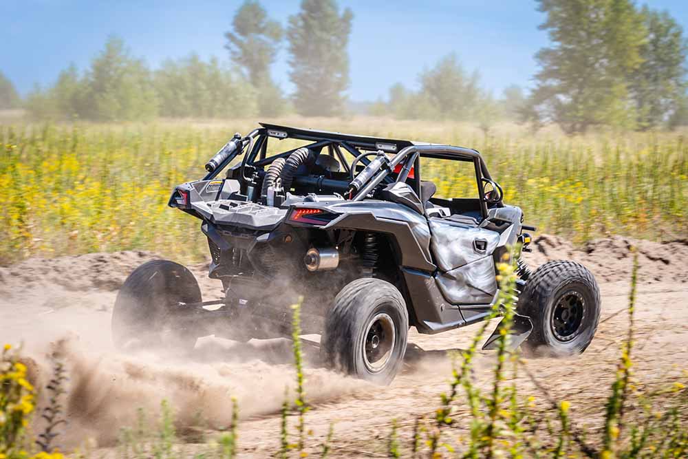 A UTV speeds down a trail.